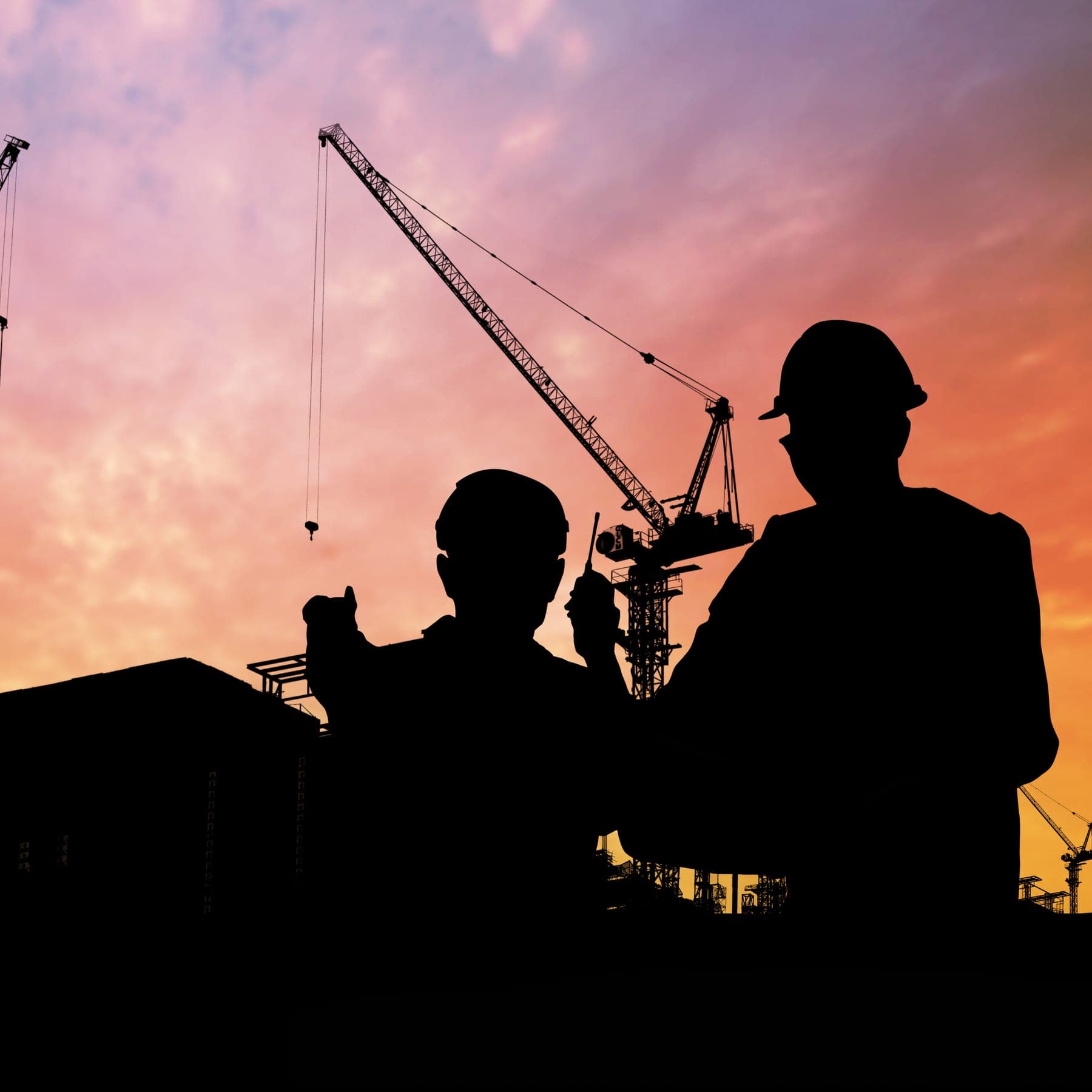 Construction crew working in early morning on site